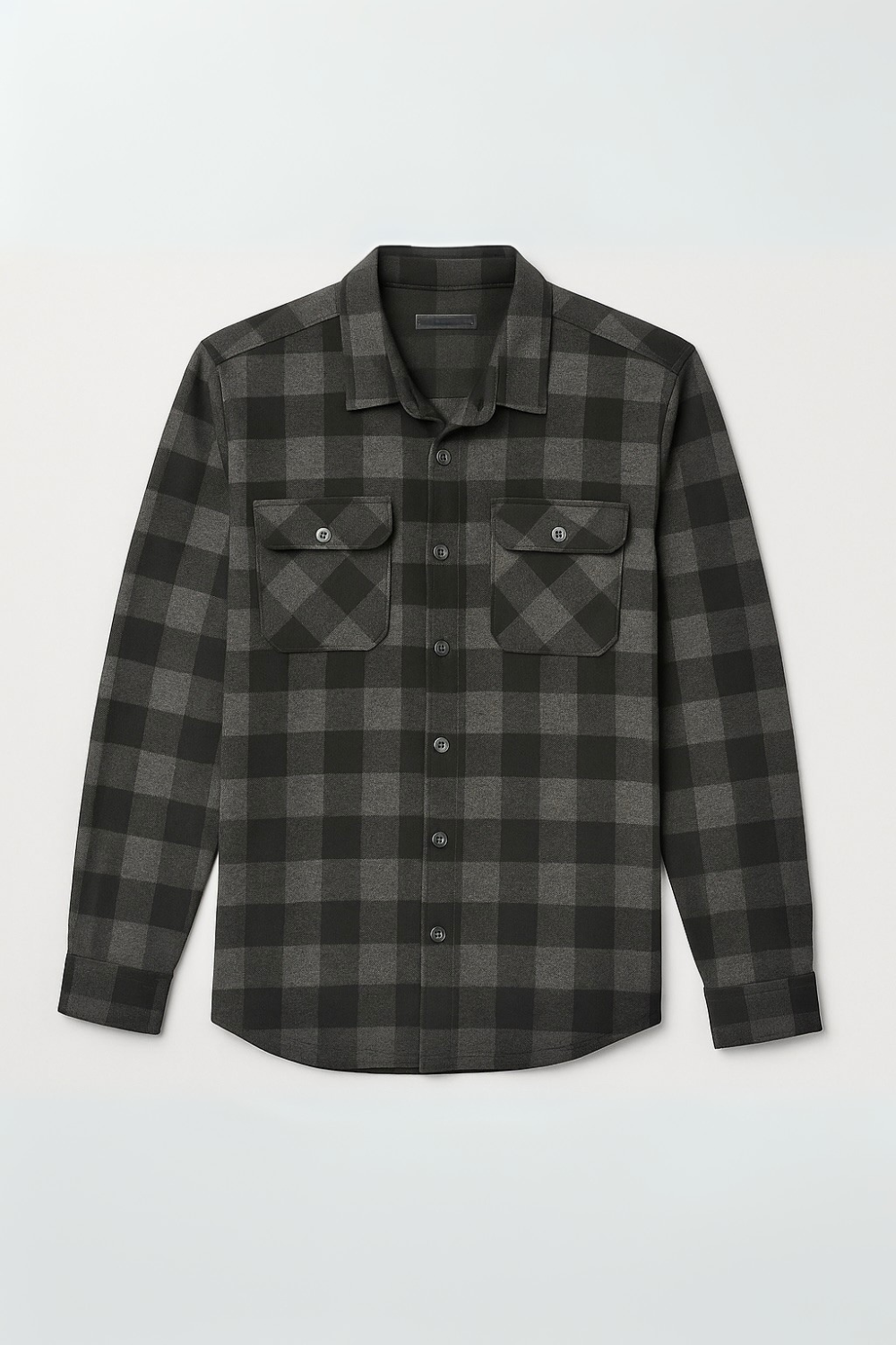 Plaid shirt with two front pockets on a light gray background