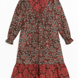 Red and black patterned dress on a white background