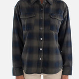 Woman wearing a plaid shirt on a white background