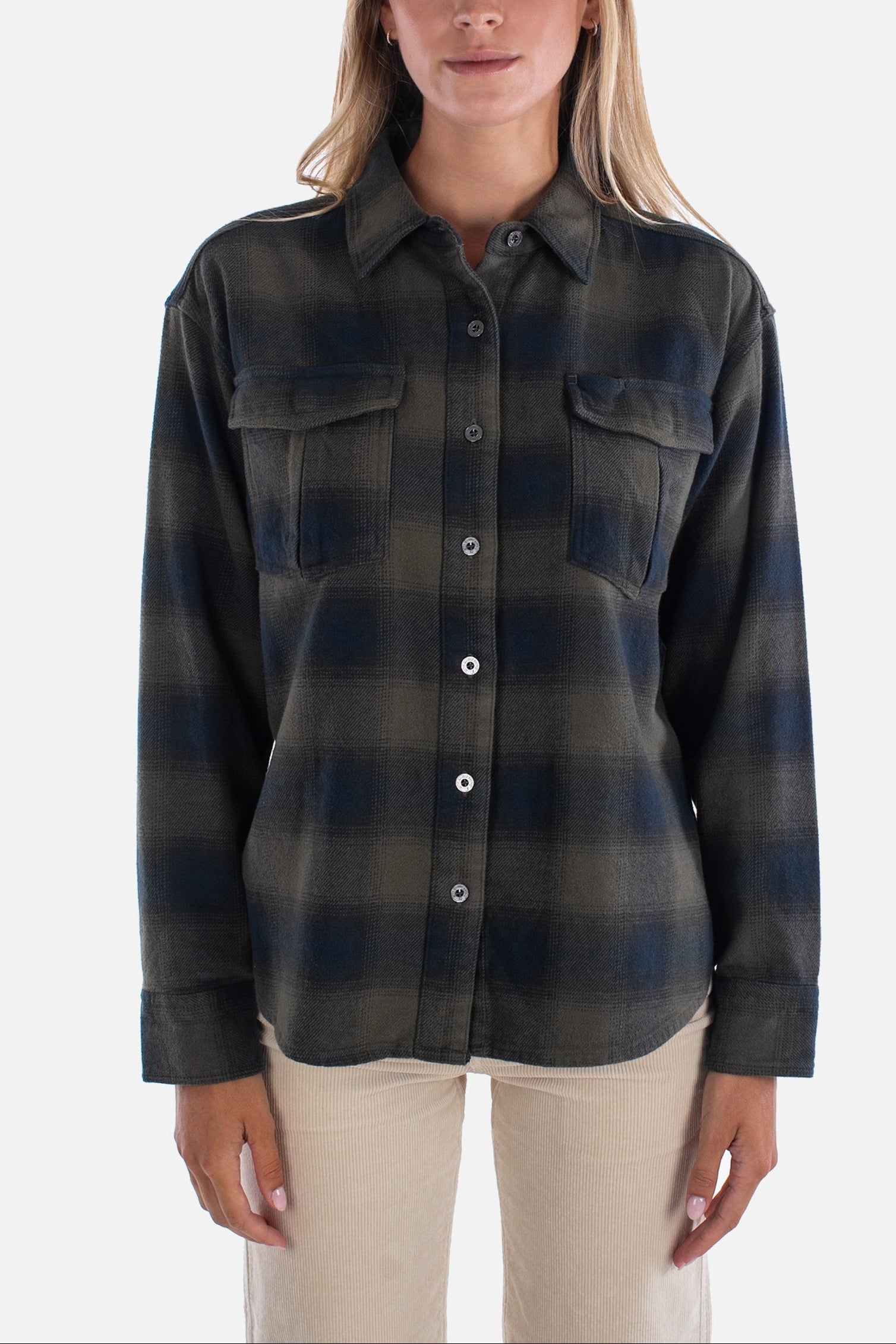 Woman wearing a plaid shirt on a white background