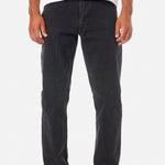 Person wearing black jeans and a white shirt on a white background