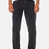 Person wearing black jeans and a white shirt on a white background