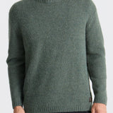 Man wearing a green sweater on a white background