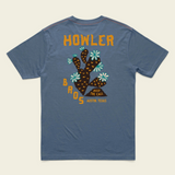 Blue t-shirt with a graphic design and text on the back, displayed on a beige background.