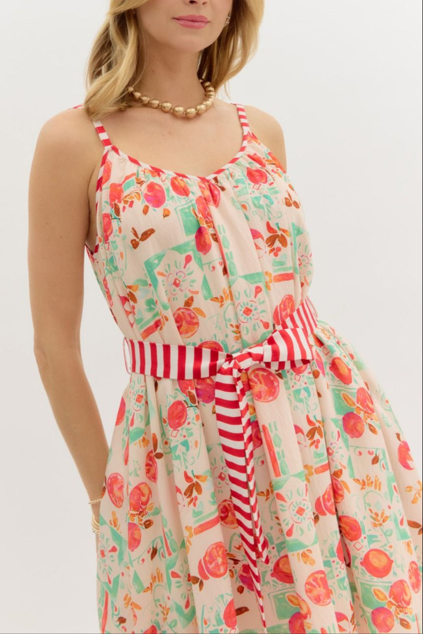 Woman wearing a floral dress with a white background