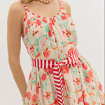 Woman wearing a floral dress with a white background