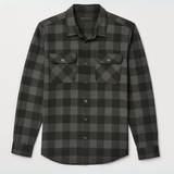 Plaid shirt with two front pockets on a light gray background