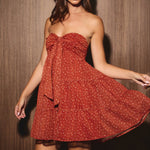 Marlowe Strapless Tiered Mini Dress in brick ditsy print, back