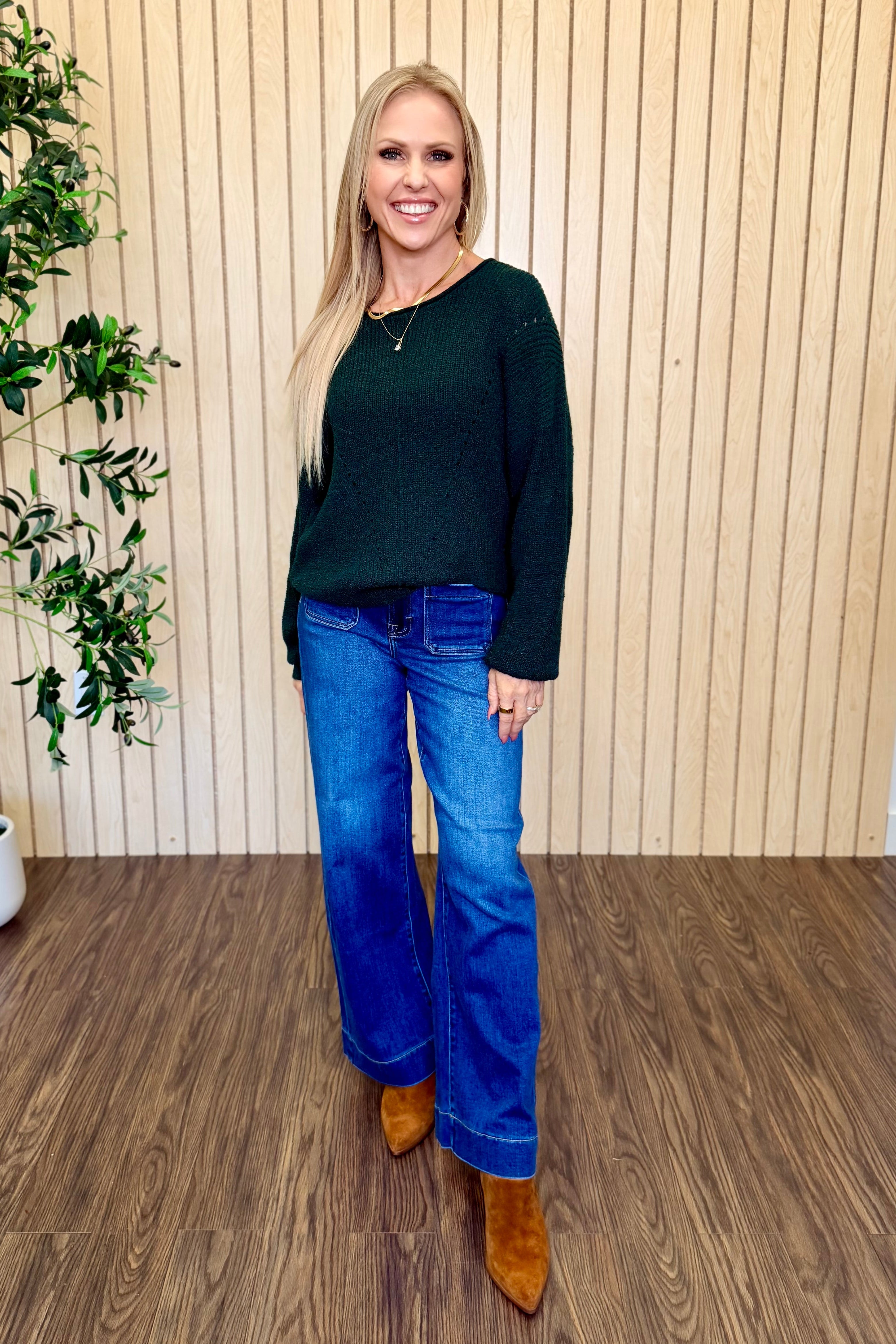Nori Front Pocket High Rise Wide Leg Jean in Dark Wash with a green sweater