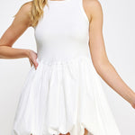 White dress worn by a model on a white background