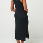 Woman wearing a black sleeveless dress on a white background