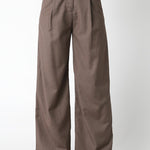 Brown wide-leg pants worn with a matching waistcoat on a white background