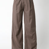 Brown wide-leg pants worn with a matching waistcoat on a white background
