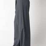 Gray wide-leg pants worn by a person on a white background