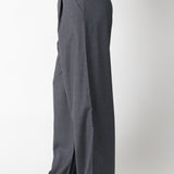 Gray wide-leg pants worn by a person on a white background