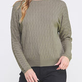 Woman wearing a green sweater on a white background