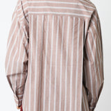 Woman wearing a striped shirt against a white background