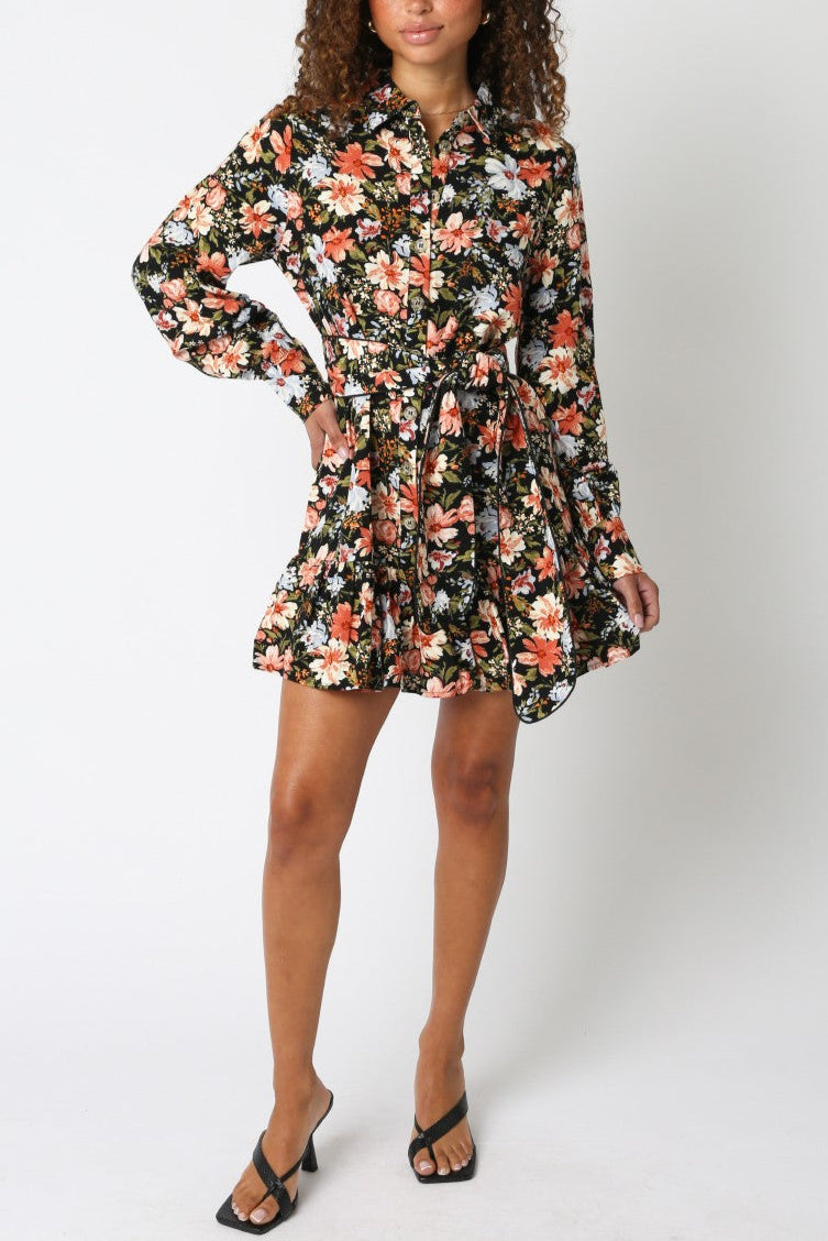 Woman wearing a floral dress on a white background