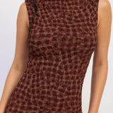 Close up of textured smocked check print fabric in espresso