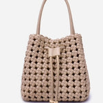 Beige woven handbag with drawstring on a light gray background