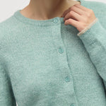 Close up of crew neckline, button front, and contrast trim