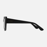 Side profile view of black CARVE Finley sunglasses showing temple arm and brand logo