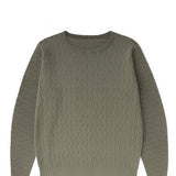 Green cable knit sweater on a white background