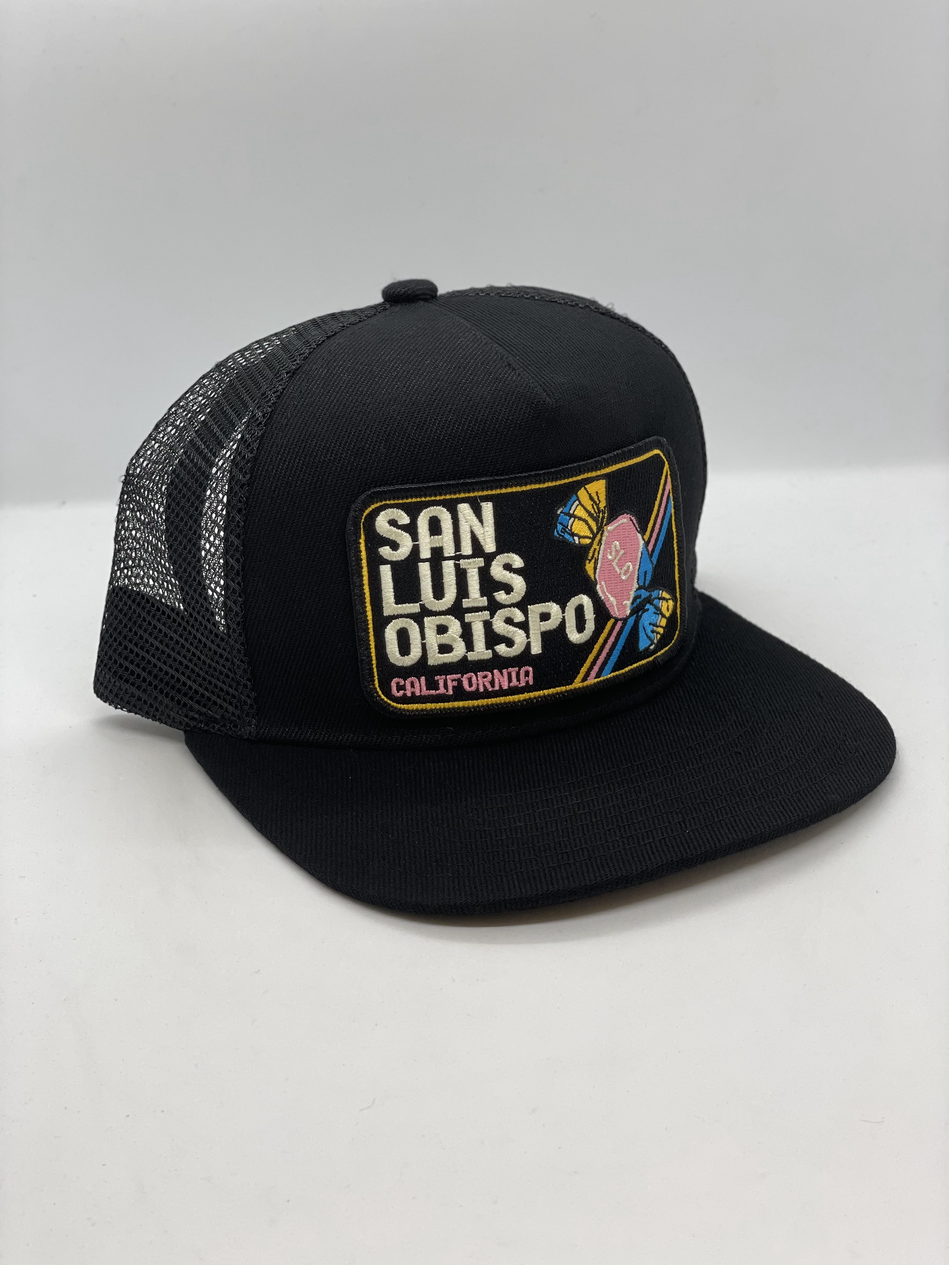 Black trucker cap with 'San Luis Obispo, California' patch on a white background