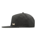 The side view of the melin Horizon Fit Trenches Icon Hydro hat in faded black