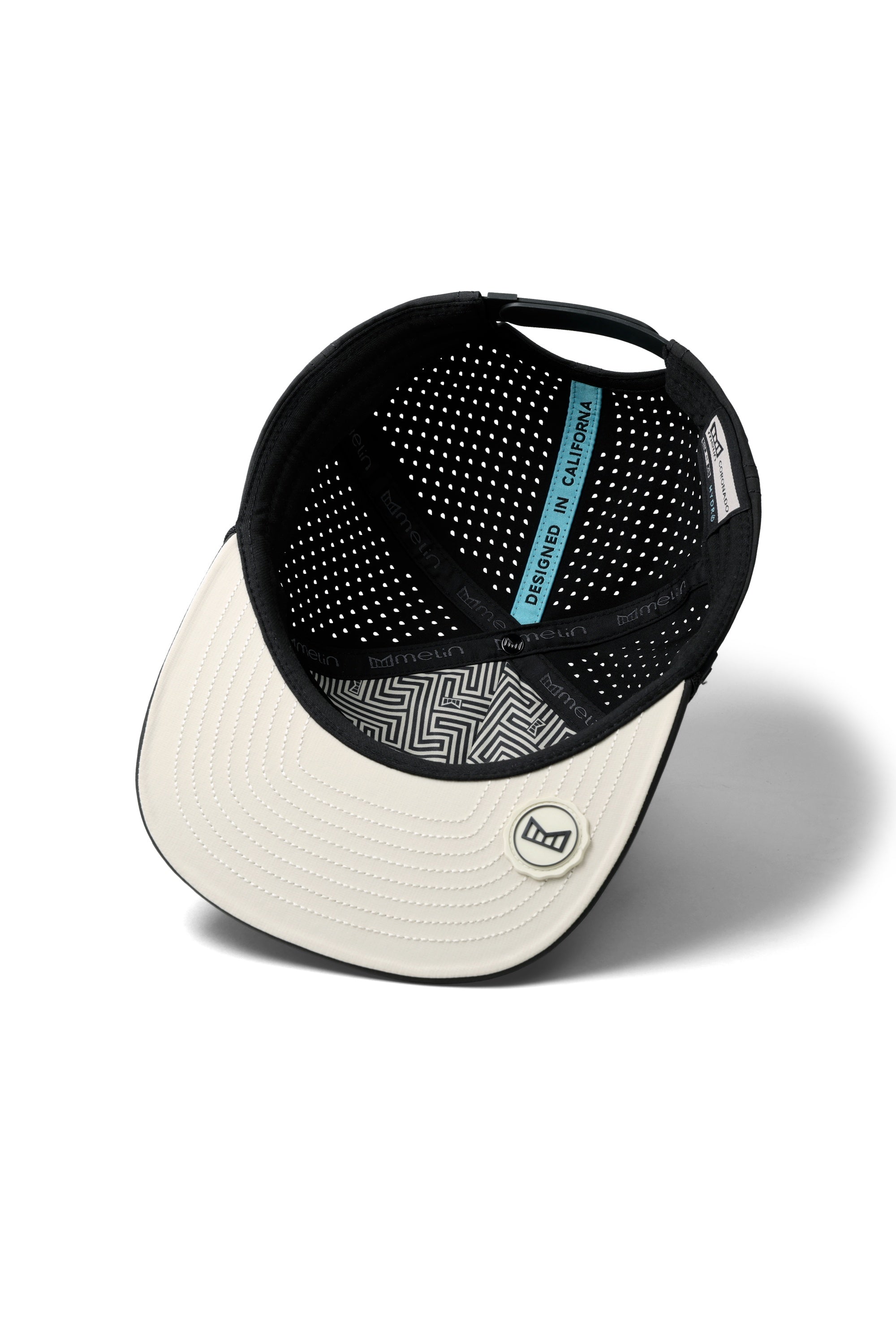 The inside view of the melin Split Crushed Fit Coronado Brick Hydro hat in faded black
