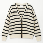 Striped cardigan with black and white stripes on a white background