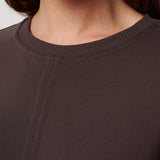 Close-up of a brown sweater with a focus on the neckline.