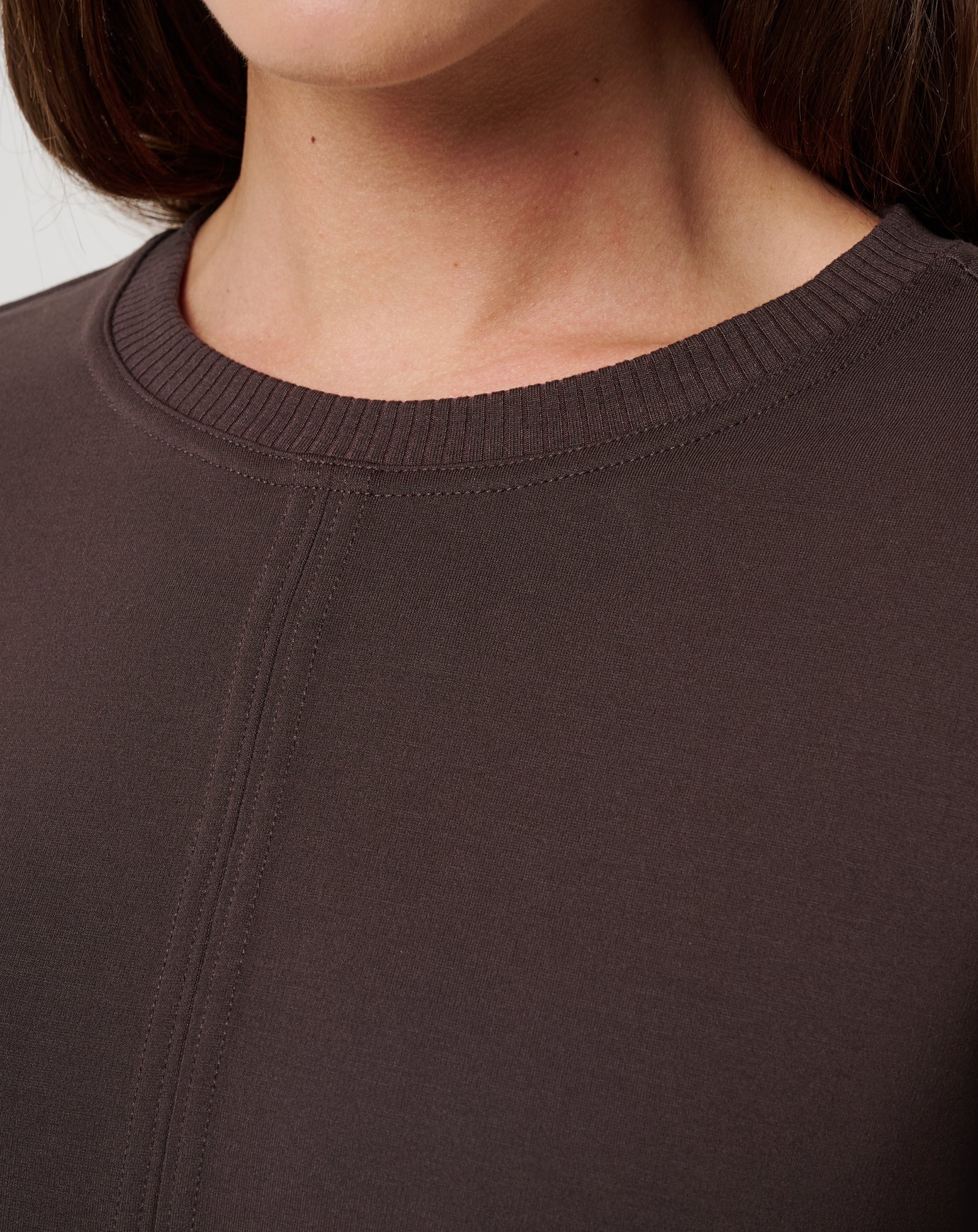 Close-up of a brown sweater with a focus on the neckline.