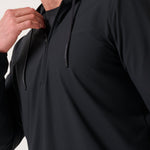 Travis Mathew Hero Hour Tech Hoodie in Black, worn