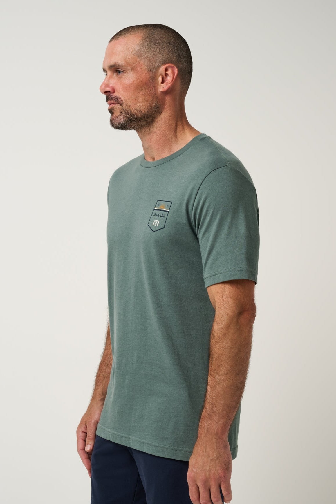 Club Charm Tee in Balsam Green, side view