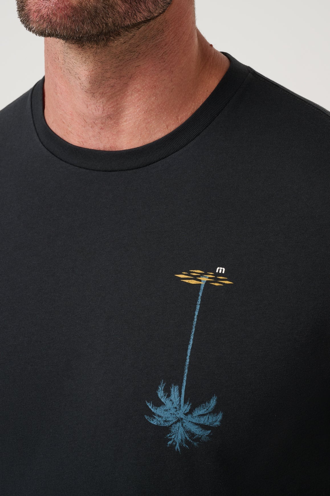 Travis Mathew Sundown Soiree Tee in Black, palm graphic detail