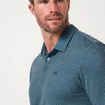 Travis Mathew Featherweight Flair Polo in Aegean, print detail