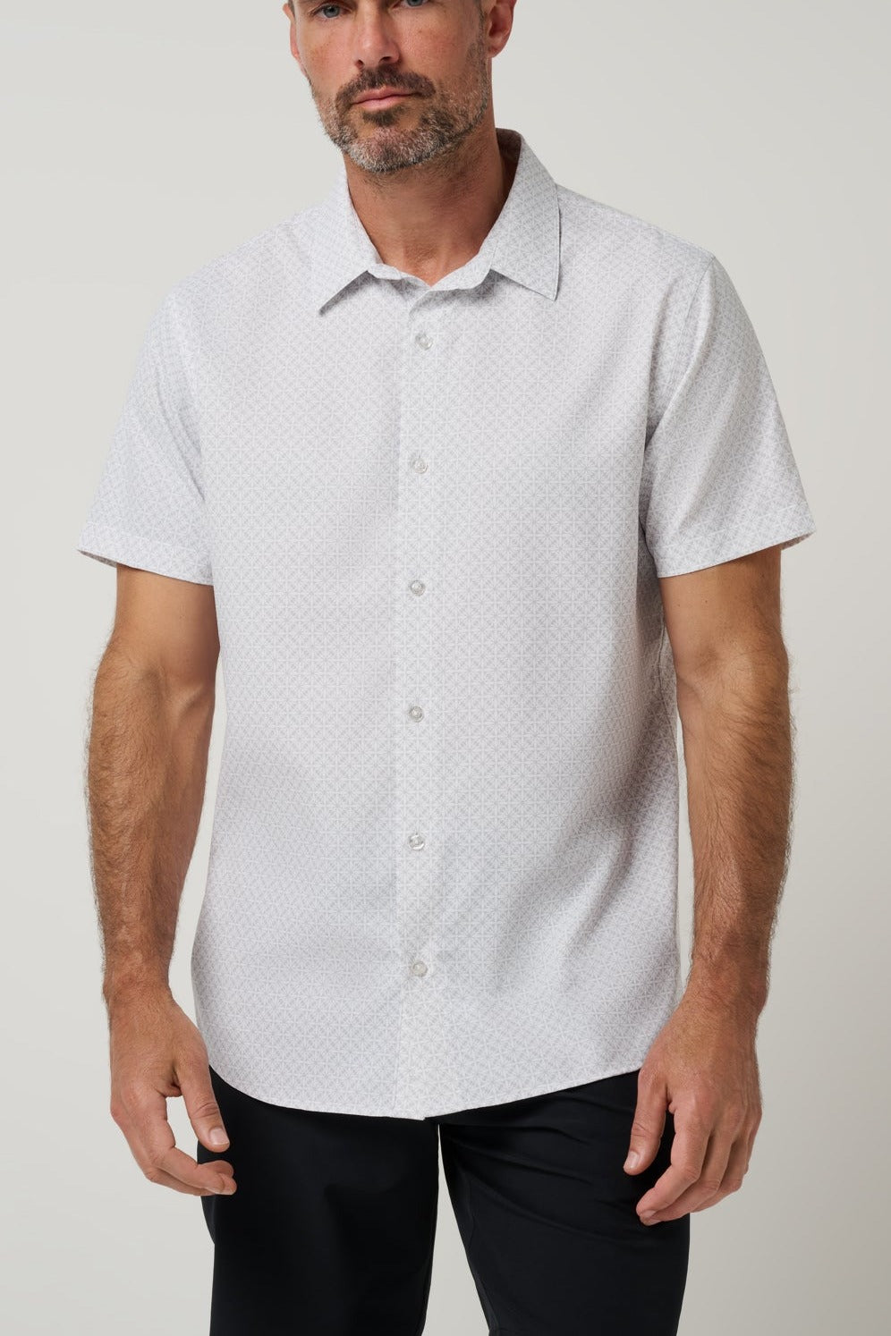 Travis Mathew Techwoven Flair Button-Up in White, front view