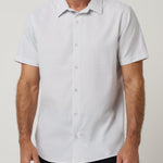 Travis Mathew Techwoven Flair Button-Up in White, front view