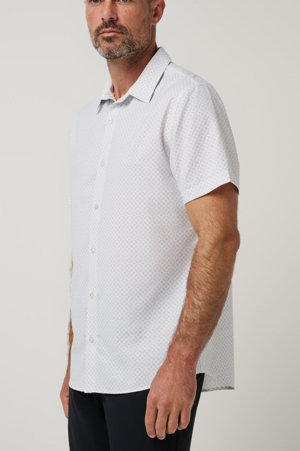 Travis Mathew Techwoven Flair Button-Up in White, side view