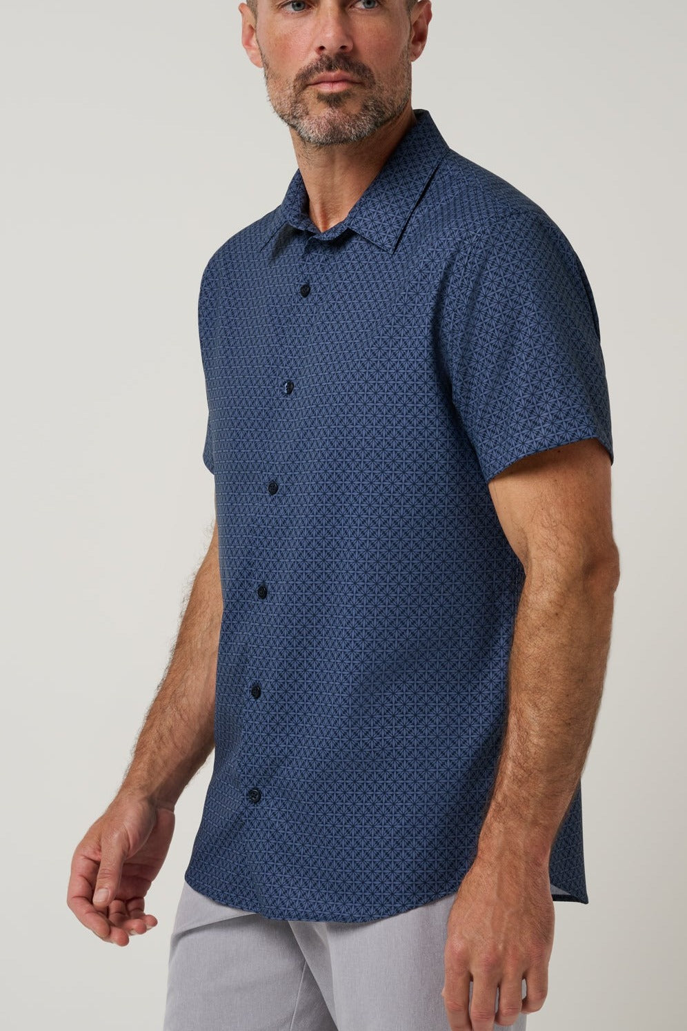 Travis Mathew Techwoven Flair Button-Up in Total Eclipse, side view