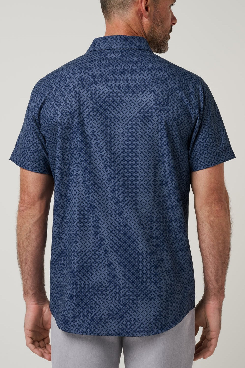 Travis Mathew Techwoven Flair Button-Up in Total Eclipse, back view