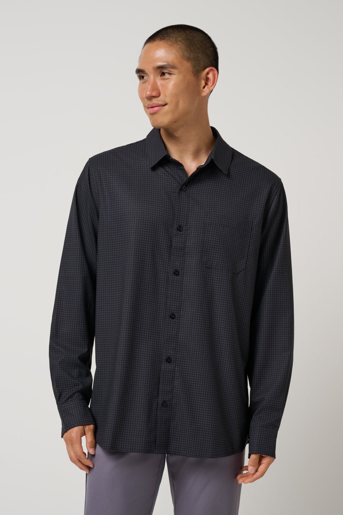 Travis Mathew Techwoven Cross Check Button-Up in Black, front view