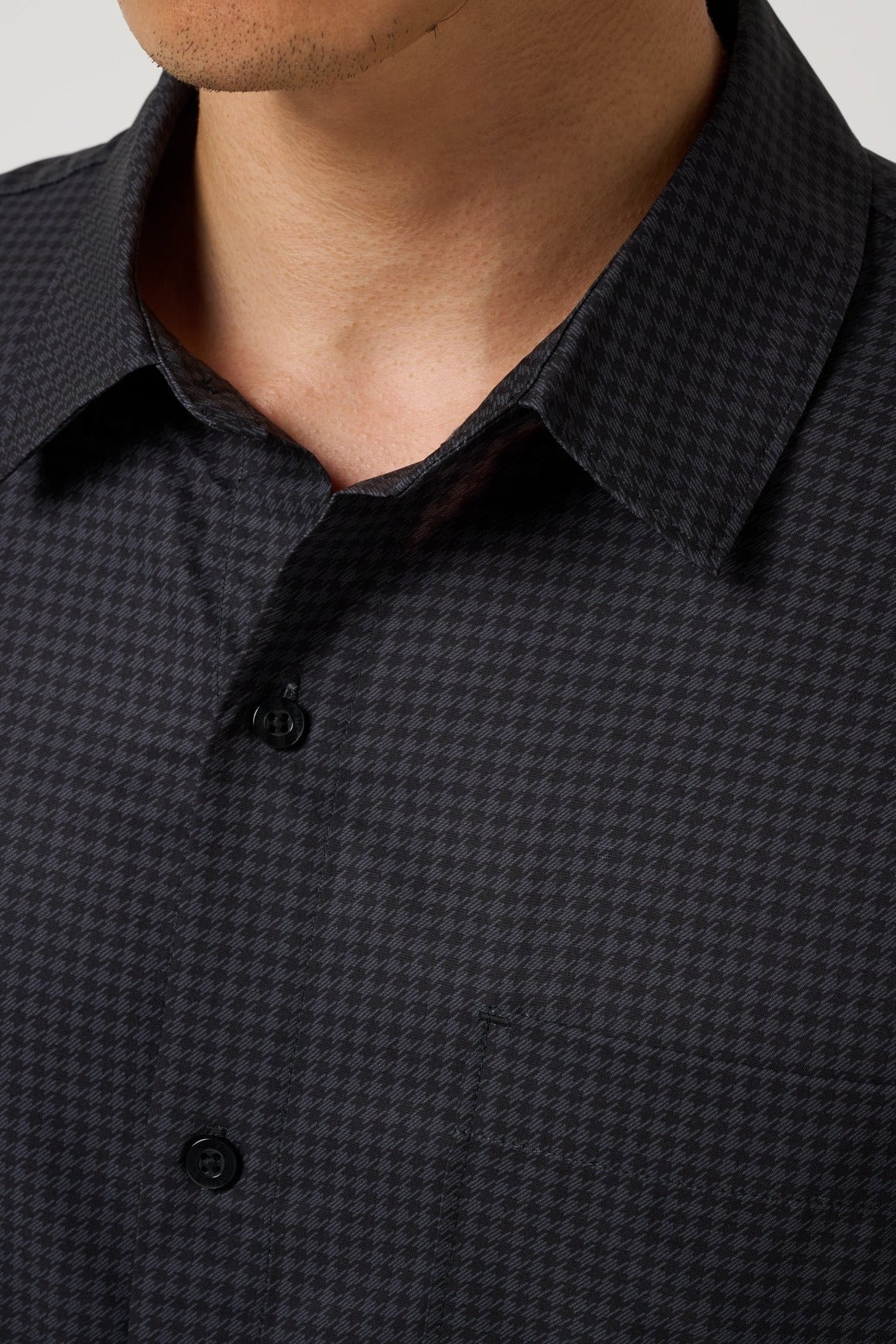 Close up of the tonal check weave and collar on the Black Techwoven Cross Check Button-Up
