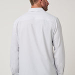 Travis Mathew Techwoven Cross Check Button-Up in White, back view showing curved hem