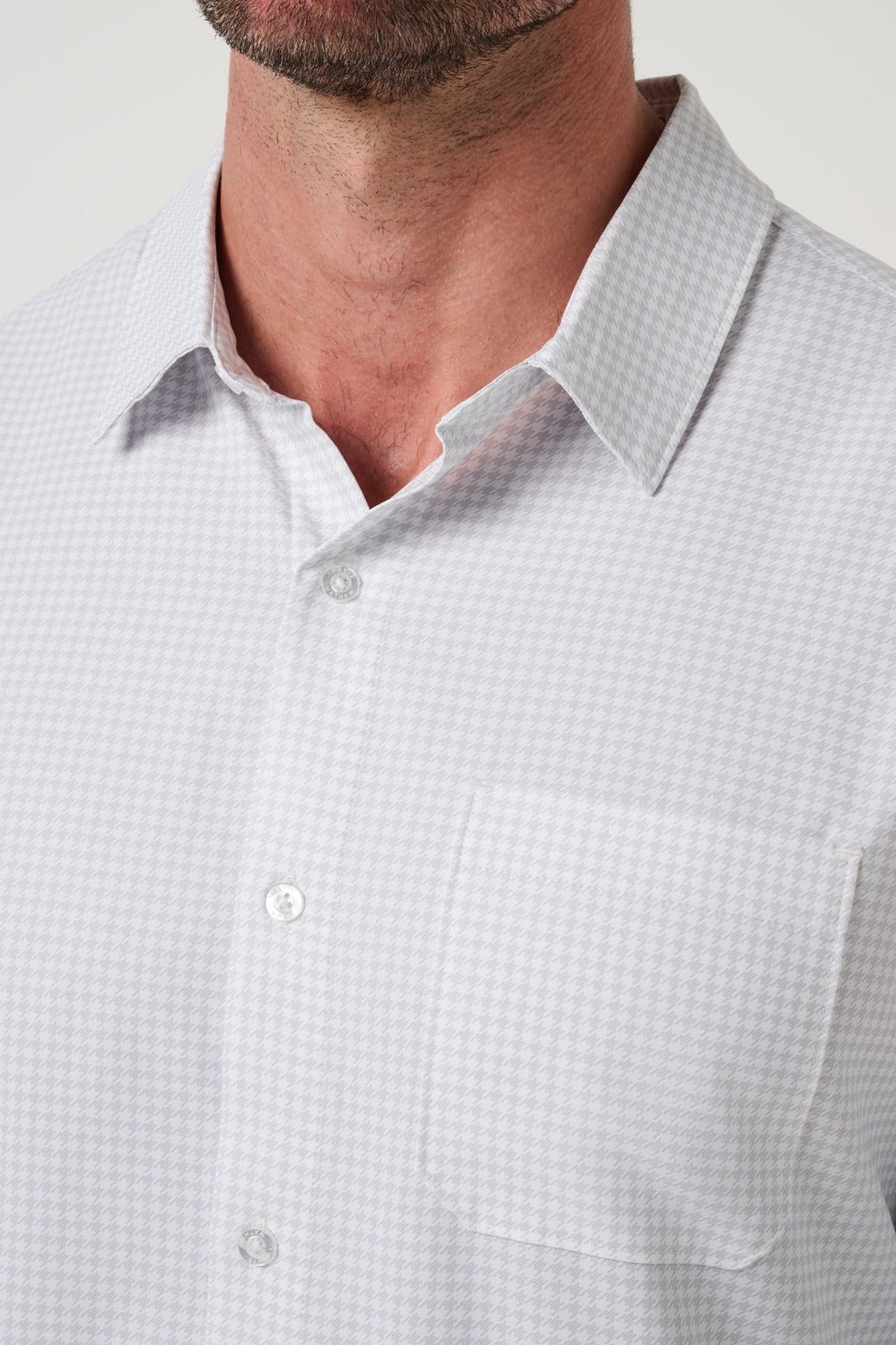 Close up of the tonal check weave and chest pocket on the White Techwoven Cross Check Button-Up