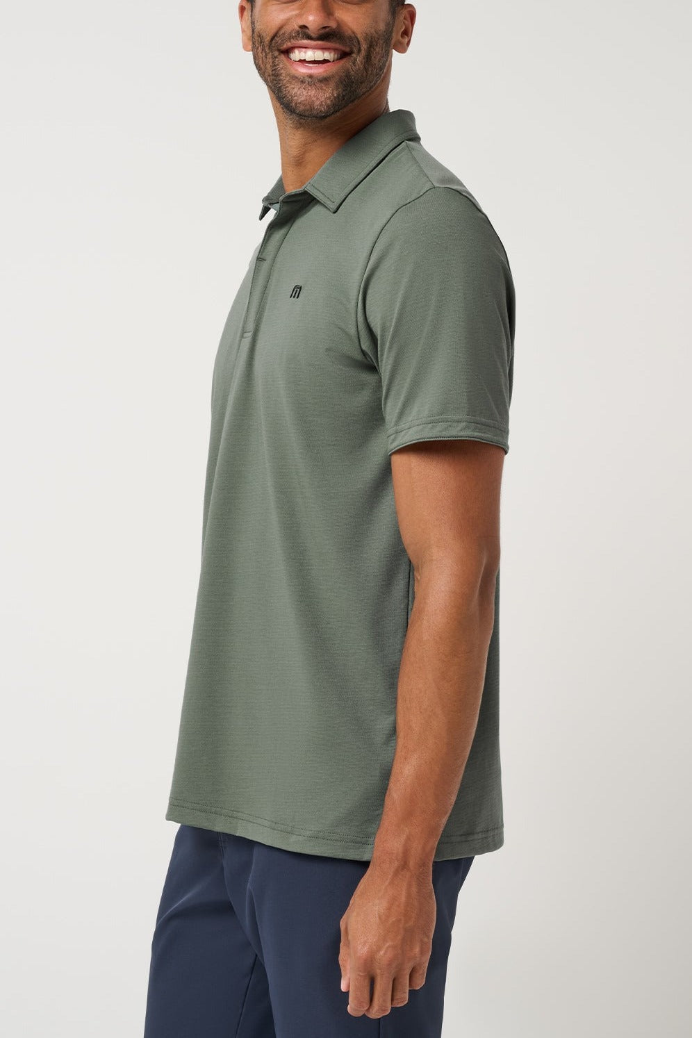 Travis Mathew Heater Series Jersey Polo in Balsam Green, side view