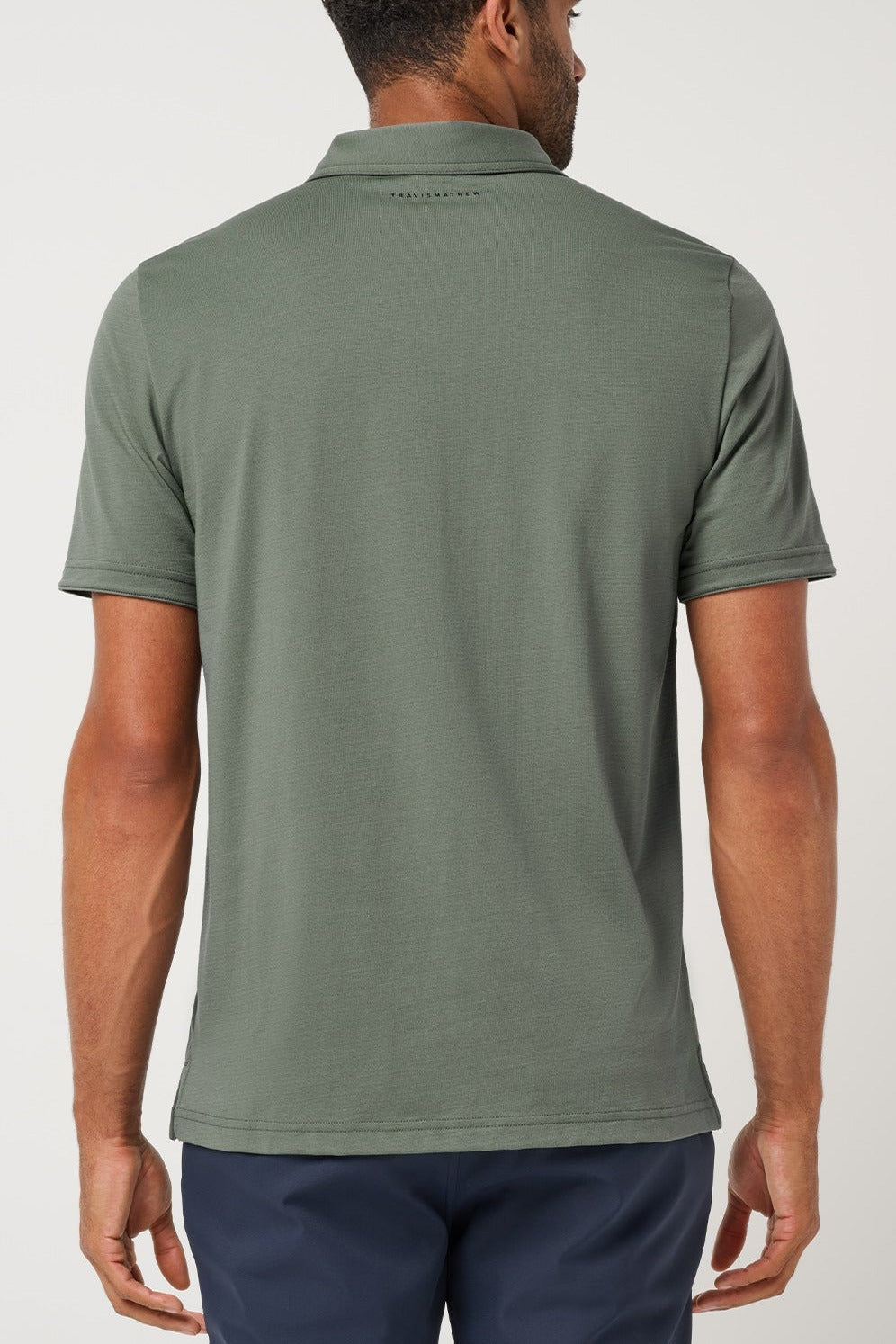 Travis Mathew Heater Series Jersey Polo in Balsam Green, back view
