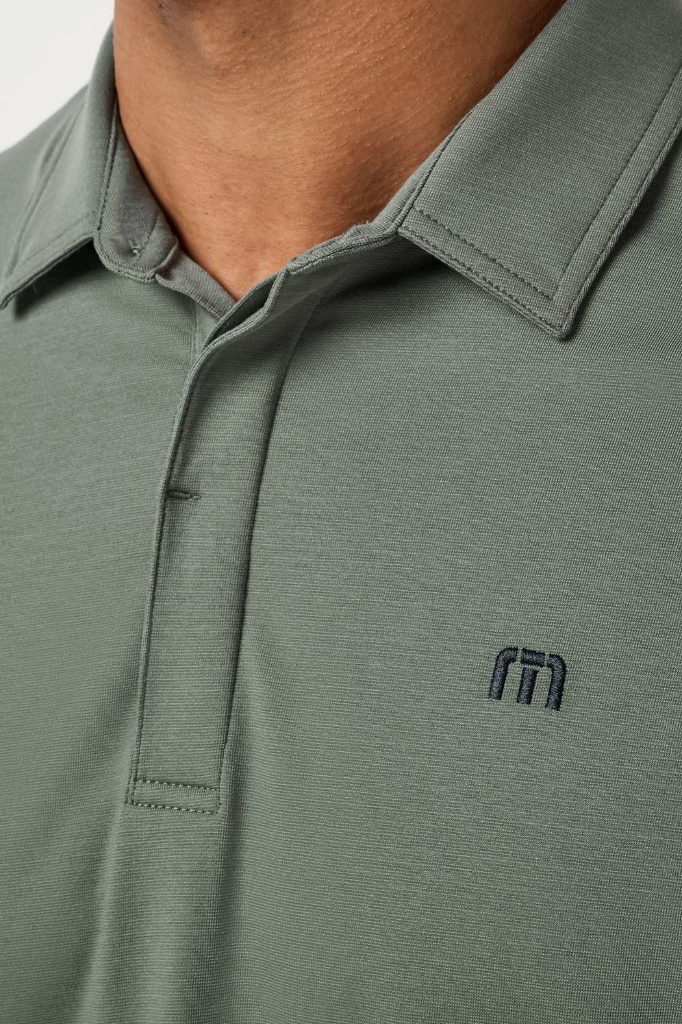 Travis Mathew Heater Series Jersey Polo in Balsam Green, detail view