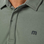 Travis Mathew Heater Series Jersey Polo in Balsam Green, detail view